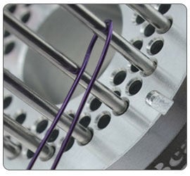 Wire being wrapped around jig pegs